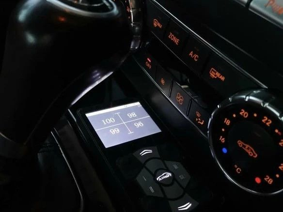 AIRBFT digital air suspension controller installed in a vehicle